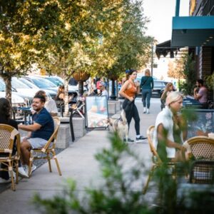 Scenic sidwalk image of patrons enjoying a fall day at Knox Street