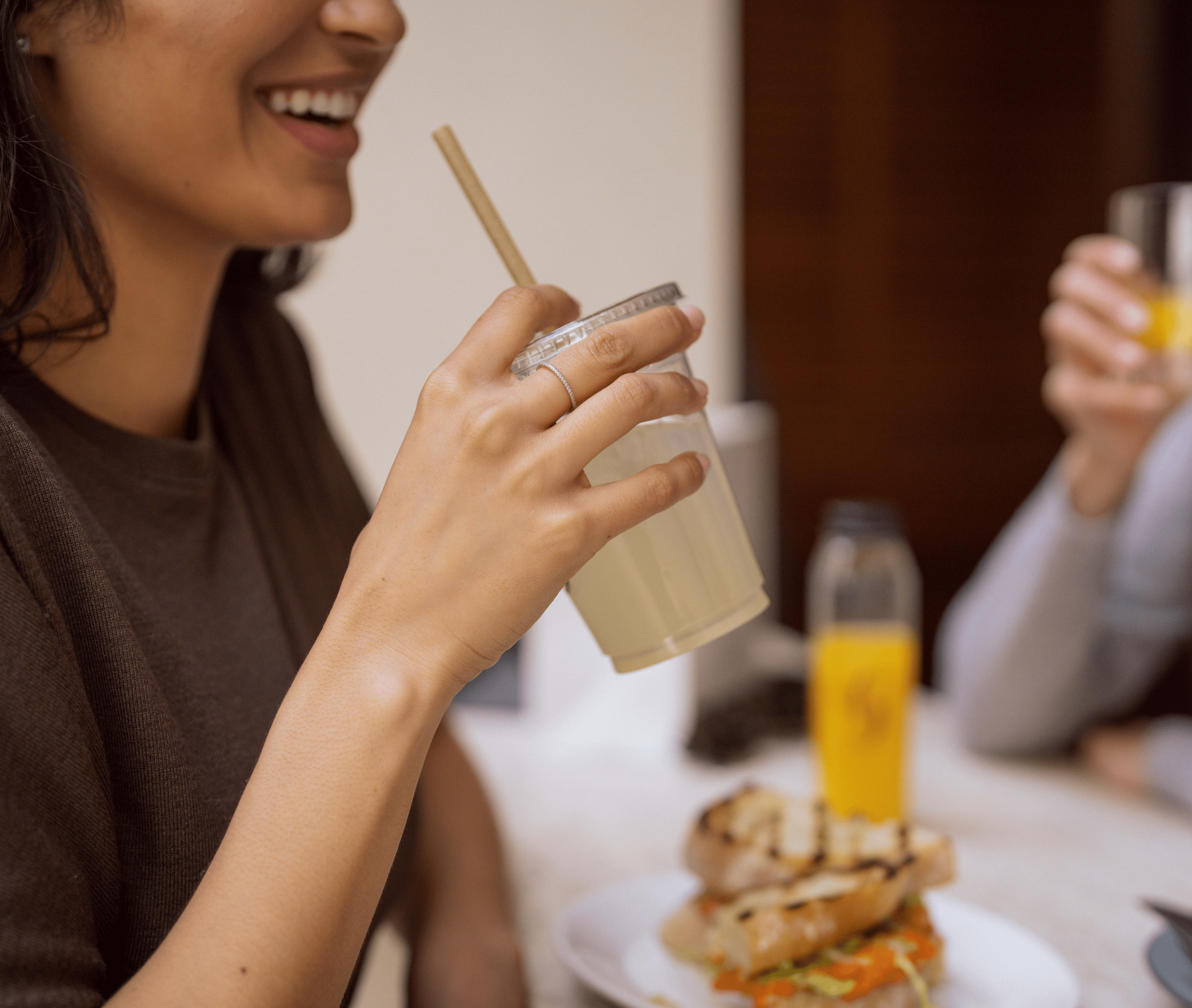 Woman drinking fresh lemonade at Georgie Butcher Shop in Dallas